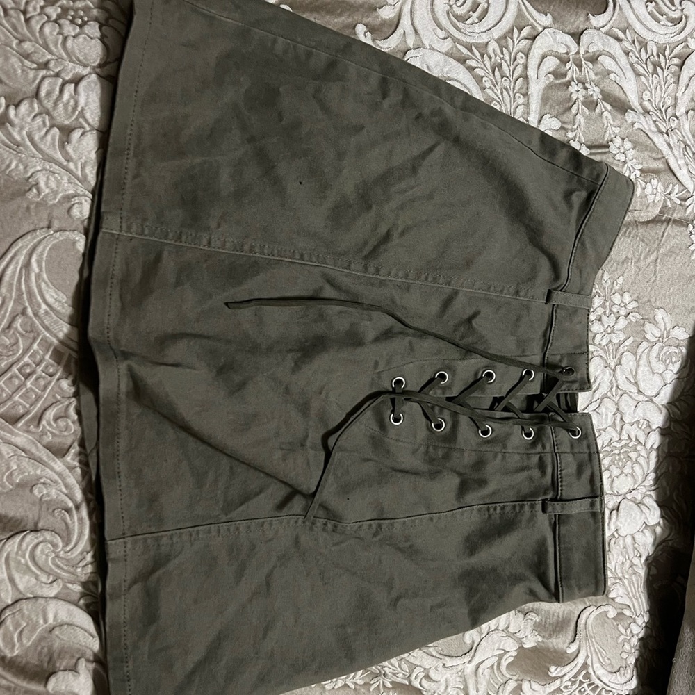 Size small mini olive green skirt never worn with tags